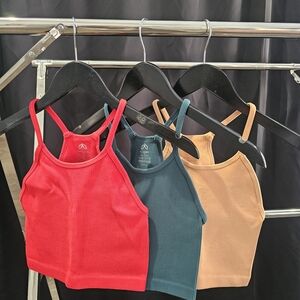 Set of Three Ribbed Crop Tops in Red, Teal, and Tan